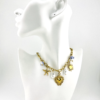 Coastal Charm: Sun, Sea, and Sacred Heart Necklace of the Embrace of the Love Heart Collection